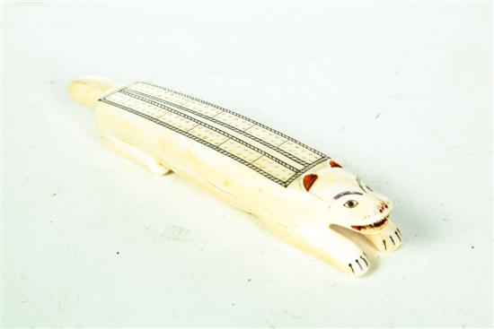 Appraisal: FIGURAL CRIBBAGE BOARD Eskimo early th century walrus tusk Diminutive