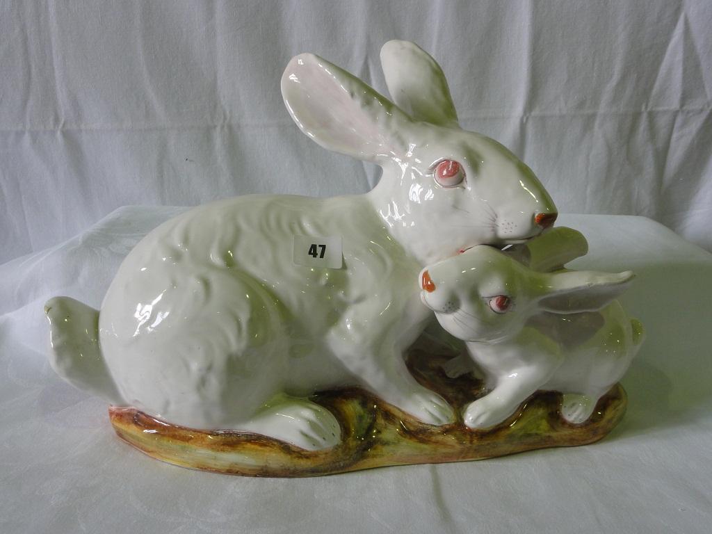 Appraisal: A large continental faience type model of two white rabbits