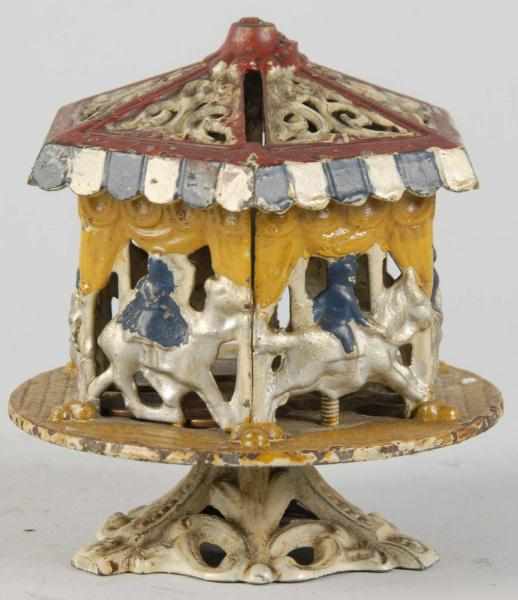 Appraisal: Cast Iron Merry-Go-Round Semi-Mechanical Bank Description Working Condition Excellent Size