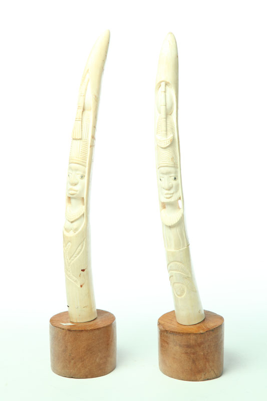 Appraisal: PAIR OF IVORY CARVINGS Africa early th century Tusks with