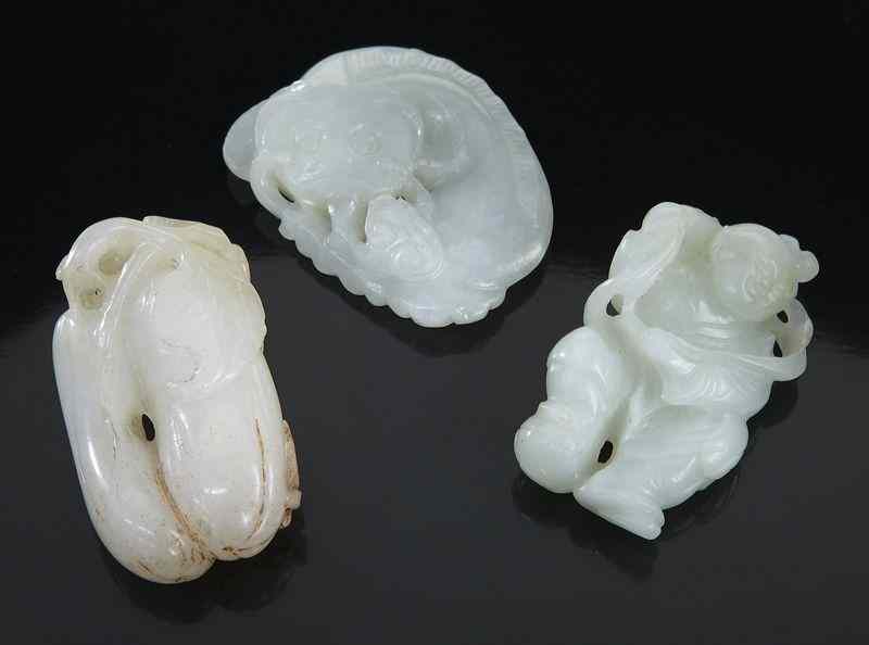 Appraisal: Chinese Qing carved jade toggles including catfish boy holding a