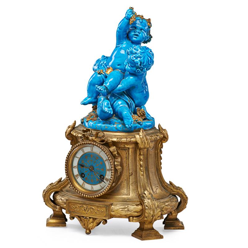 Appraisal: FRENCH PORCELAIN MANTEL CLOCK Enameled porcelain figures of cherubs on