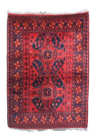 Appraisal: A wine ground Persian rug with floral designs ' x