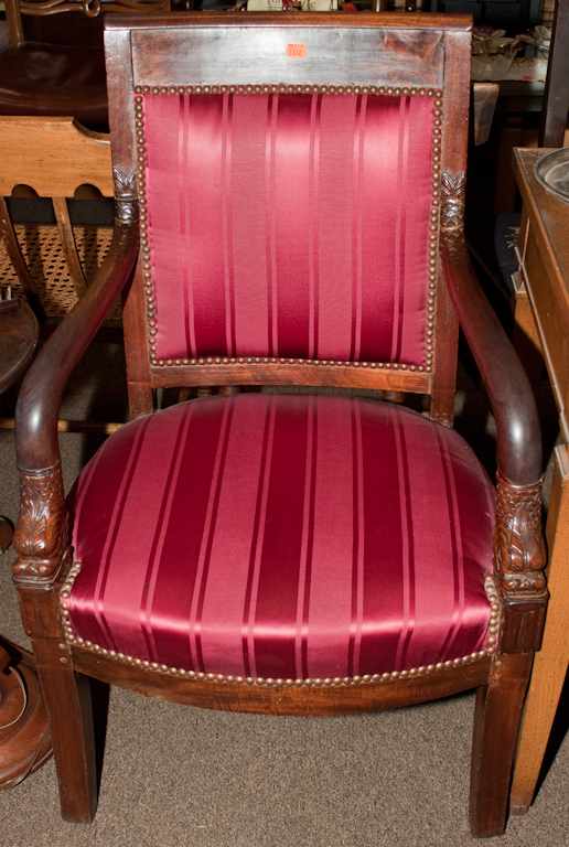 Appraisal: French Empire carved mahogany upholstered armchair first quarter- th century