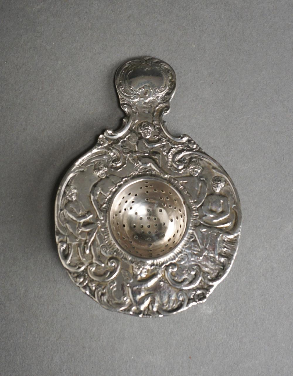 Appraisal: CONTINENTAL -SILVER PUTTI-DECORATED TEA STRAINER OZTContinental -Silver Putti-Decorated Tea Strainer