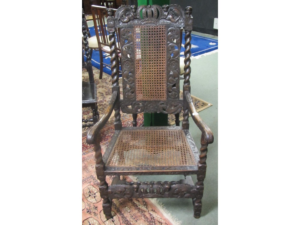 Appraisal: Carved oak elbow chair with cane seat and back