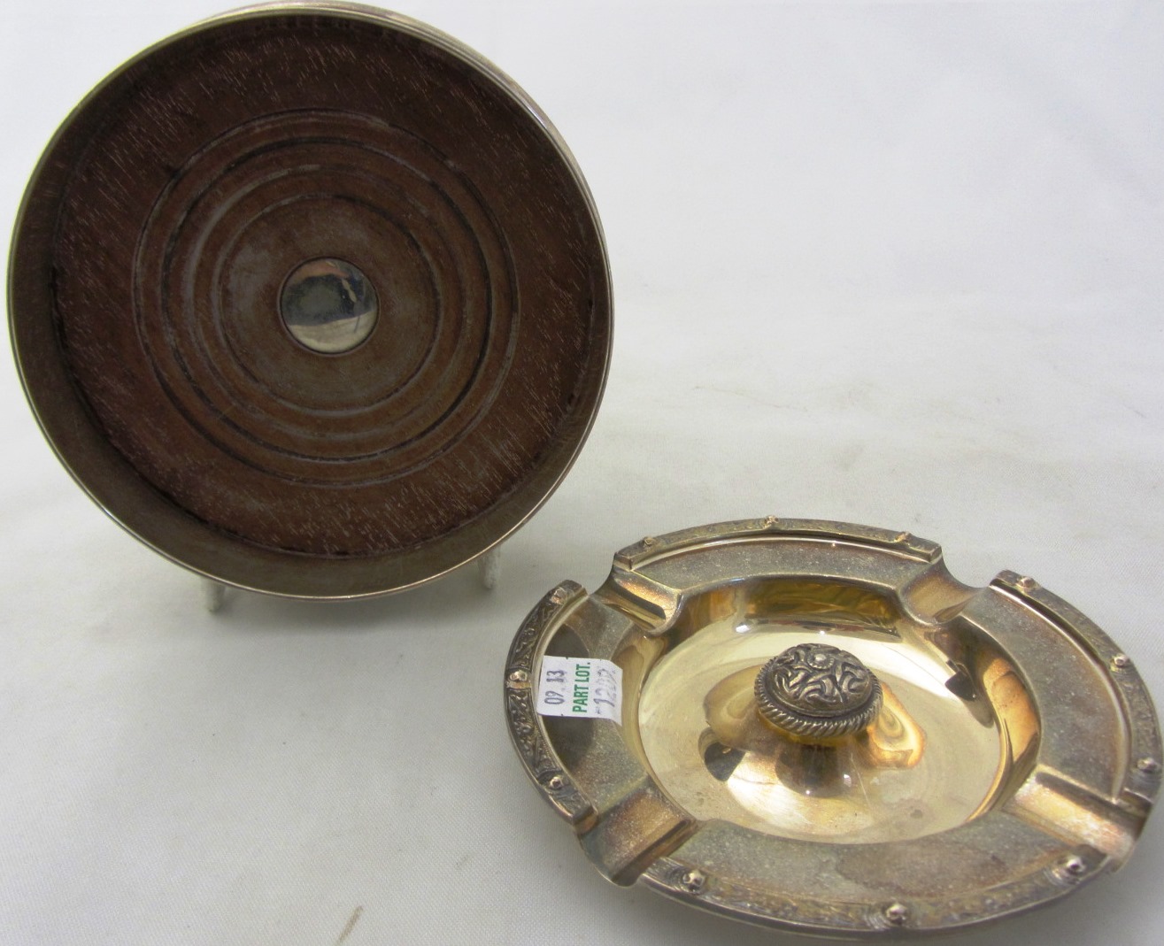 Appraisal: A silver mounted bottle coaster of circular form with a