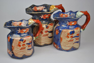 Appraisal: Three Victoria Ironstone octagonal jugs each with a dragon moulded