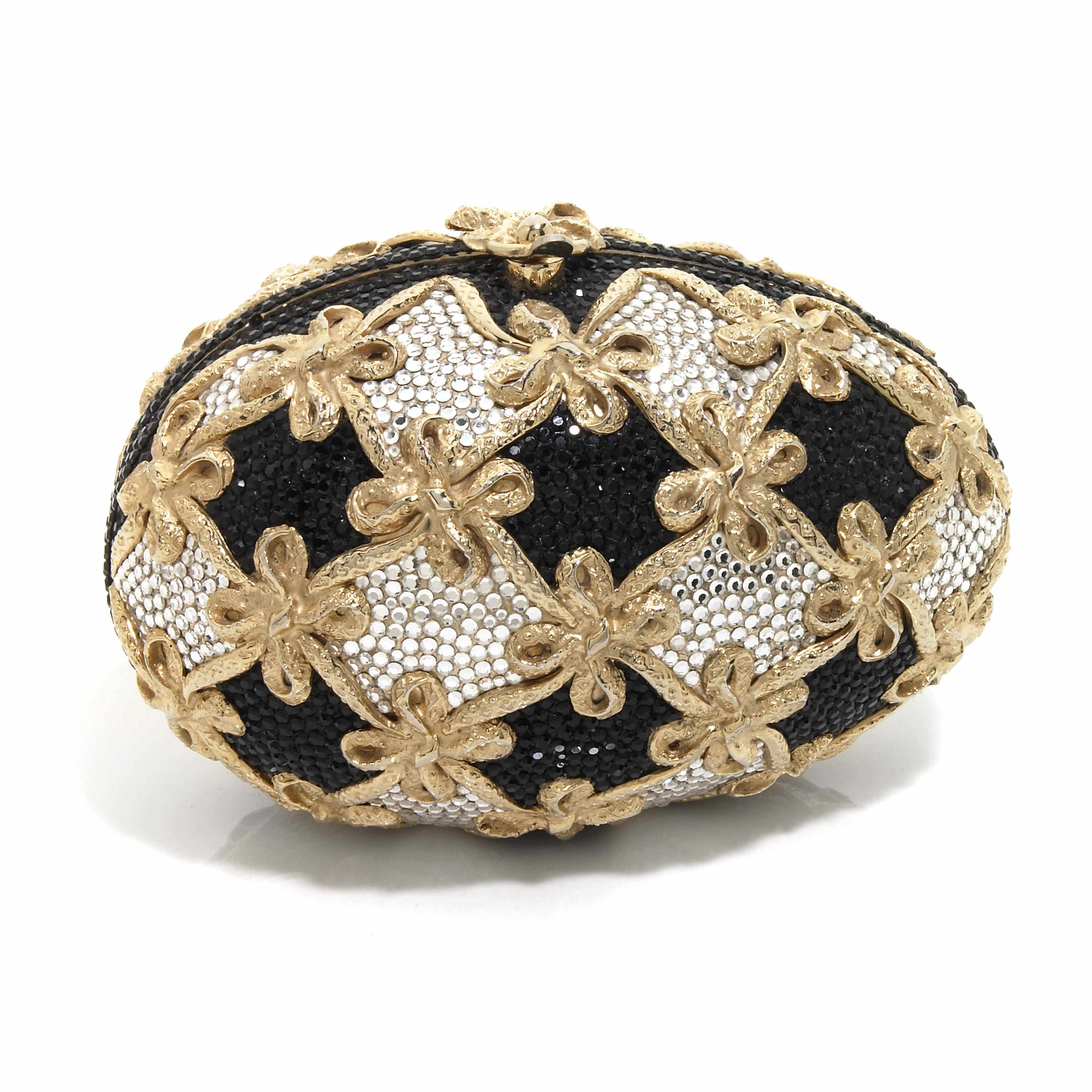 Appraisal: A black egg purse with gold colored metal bows and