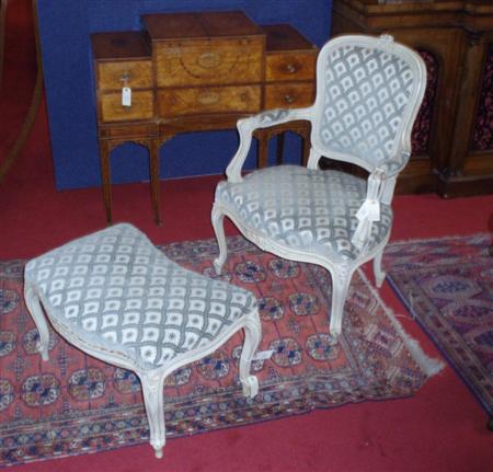 Appraisal: A grey painted fauteuil the moulded framed cushioned back mounted