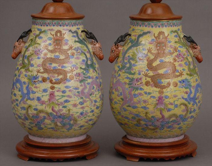 Appraisal: PAIR OF CHINESE YELLOW-GROUND FAMILLE ROSE PEAR-FORM VASES MOUNTED AS