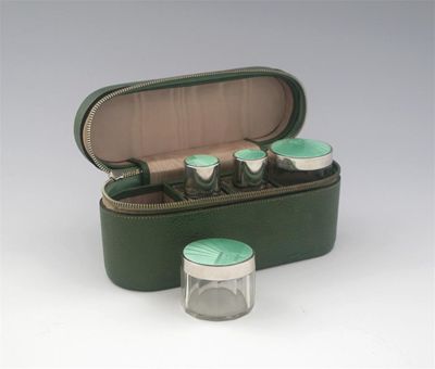 Appraisal: A modern travelling set comprising of two small oblong bottles