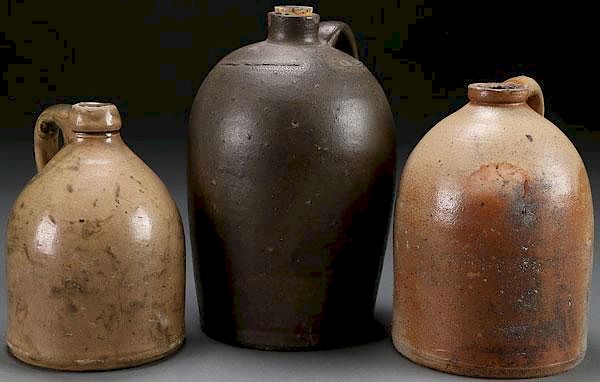 Appraisal: A GROUP OF THREE AMERICAN STONEWARE JUGS TH C A