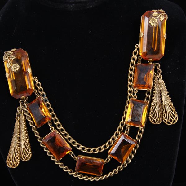 Appraisal: Art Deco Brass dress clips with Czech amber crystal filigree