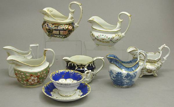 Appraisal: Seven English porcelain milk jugs and a cup and saucer