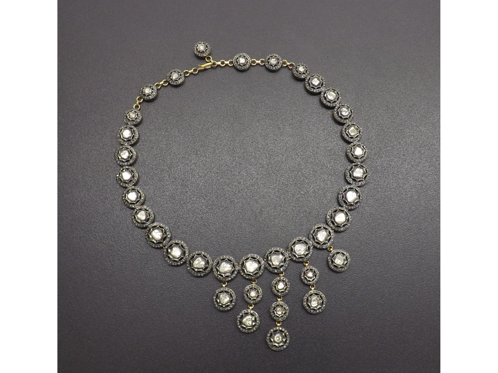 Appraisal: Impressive rose diamond necklet with pierced circular clusters on yellow