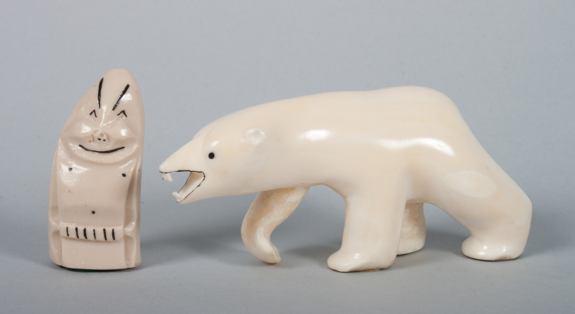 Appraisal: Two Inuit carved walrus ivory articles polar bear in H