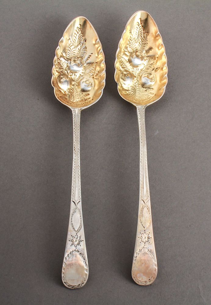 Appraisal: English Sterling Silver Repousse Berry Spoons Pair th century English