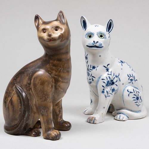 Appraisal: TWO GALLE STYLE POTTERY CATSComprising A blue and white cat