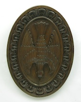 Appraisal: A Carved Oak Architectural Cartouche A carved dark oak architectural