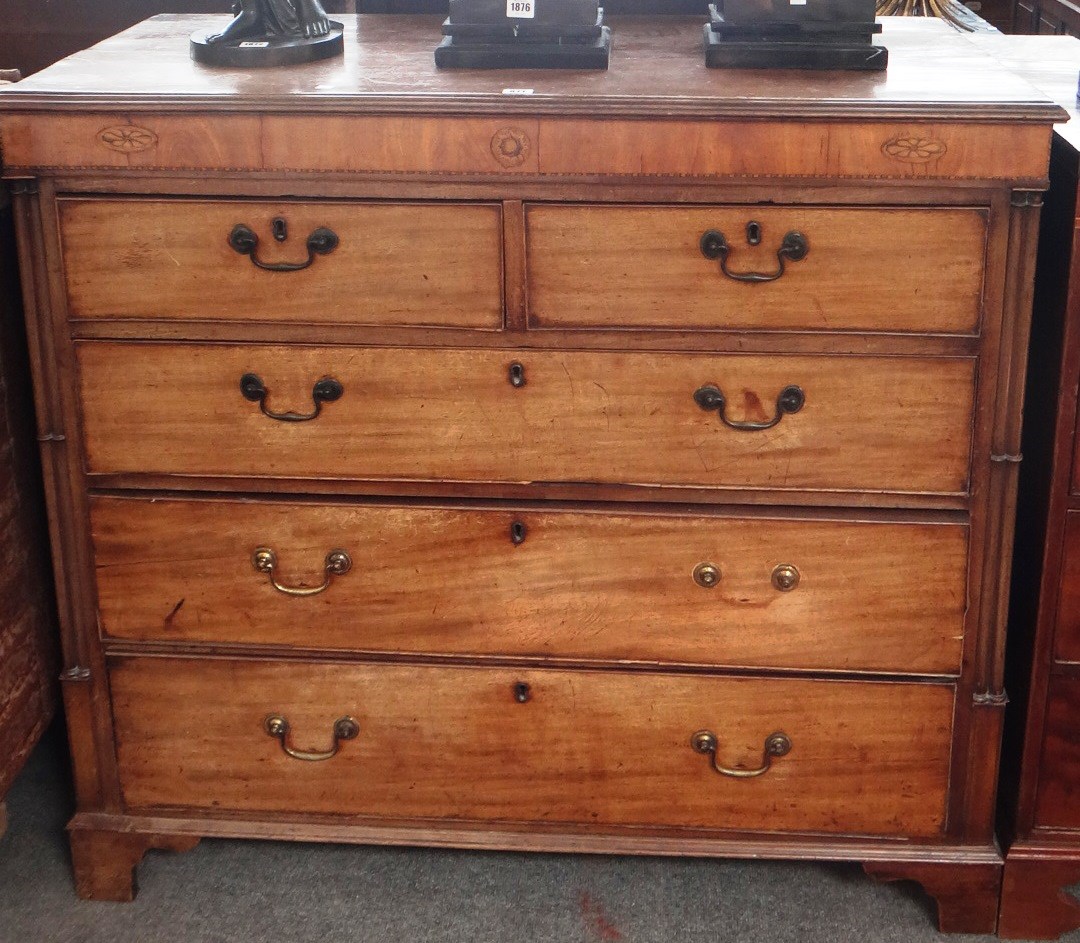 Appraisal: An inlaid George III mahogany chest of two short and