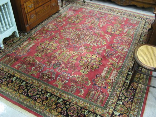 Appraisal: HAND KNOTTED ORIENTAL CARPET Indo-Sarouk overall color floral sprig design