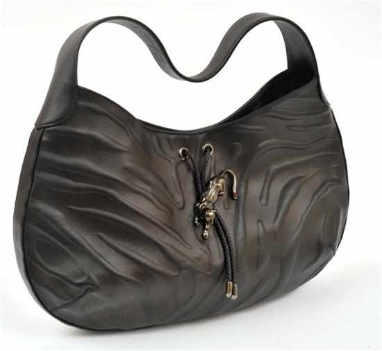 Appraisal: A PANTHER HANDBAG BY CARTIER Styled in black embossed leather