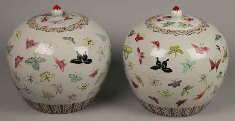 Appraisal: PAIR OF CHINESE FAMILLE ROSE ''BUTTERFLY'' JARS AND COVERS FOUR-CHARACTER