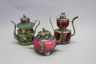 Appraisal: Tibetan Style Enameled Metal Tea Pots Tibetan Style Enameled Metal