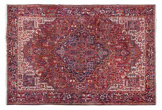 Appraisal: A Heriz Wool Rug having a central geometric medallion on