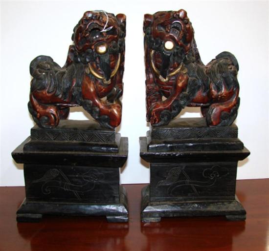 Appraisal: Pair Chinese carved and painted wood foo lions early th