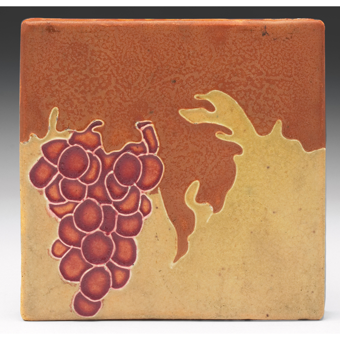 Appraisal: Owens tile large form with a grape design on a