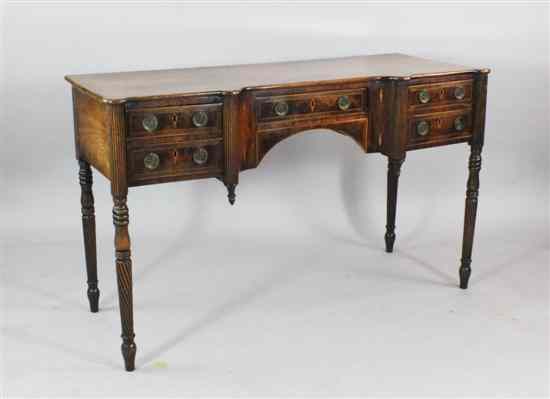 Appraisal: A Regency inlaid mahogany inverse breakfront serving table fitted with