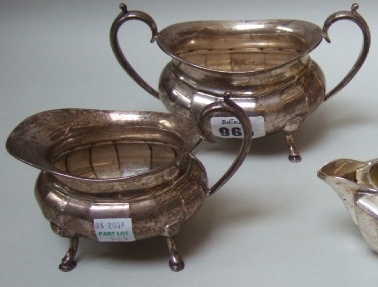 Appraisal: A silver twin handled sugar bowl the body of faceted