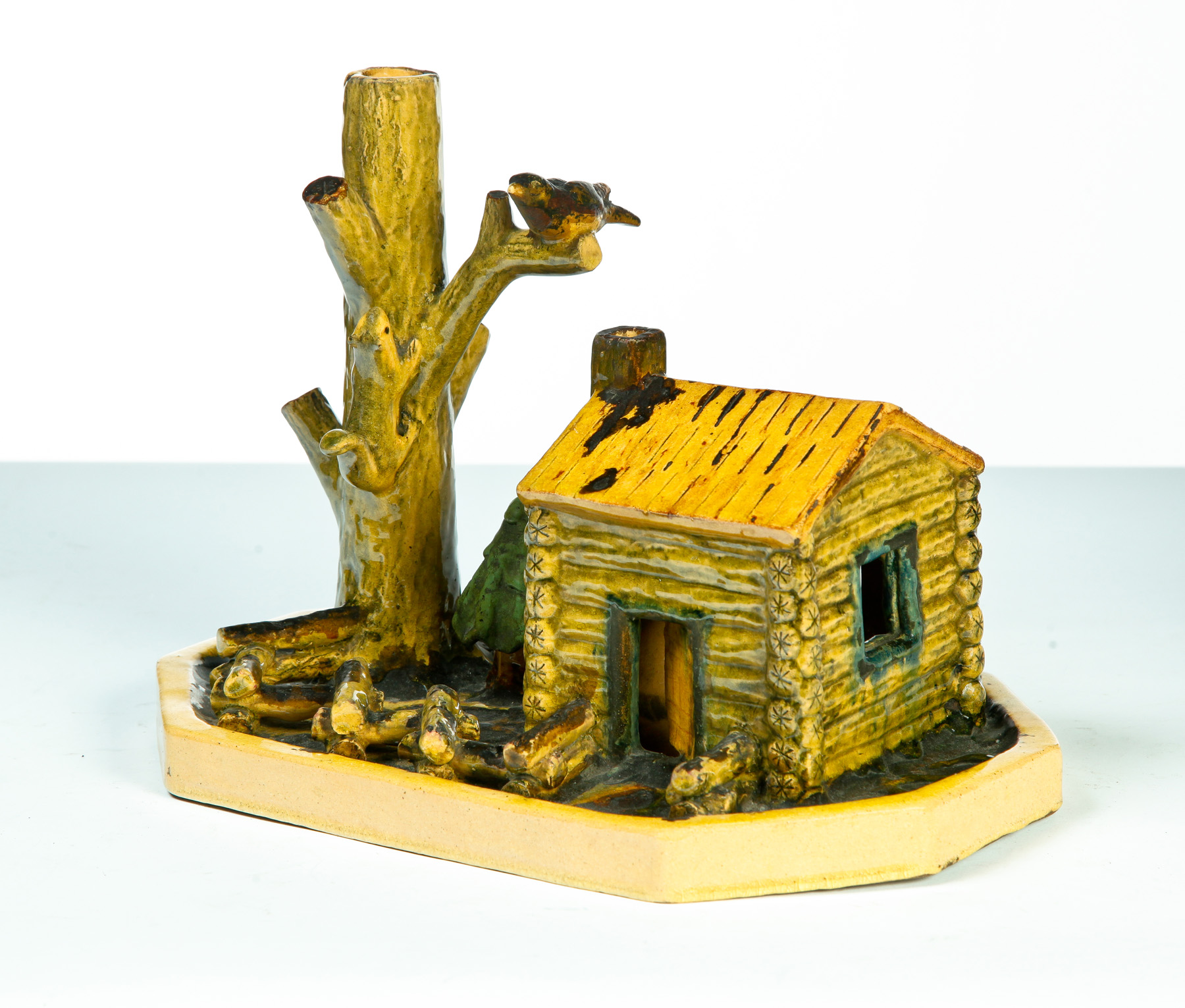 Appraisal: FOLKSY POTTERY SCULPTURE American st half- th century Cabin with