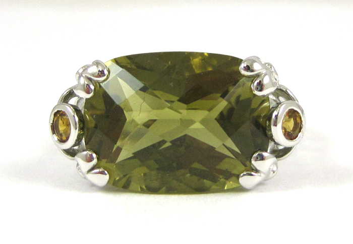 Appraisal: LEMON CITRINE AND TEN KARAT WHITE GOLD RING featuring a