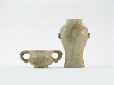 Appraisal: A Chinese jade two-handled baluster vase carved in the bronze