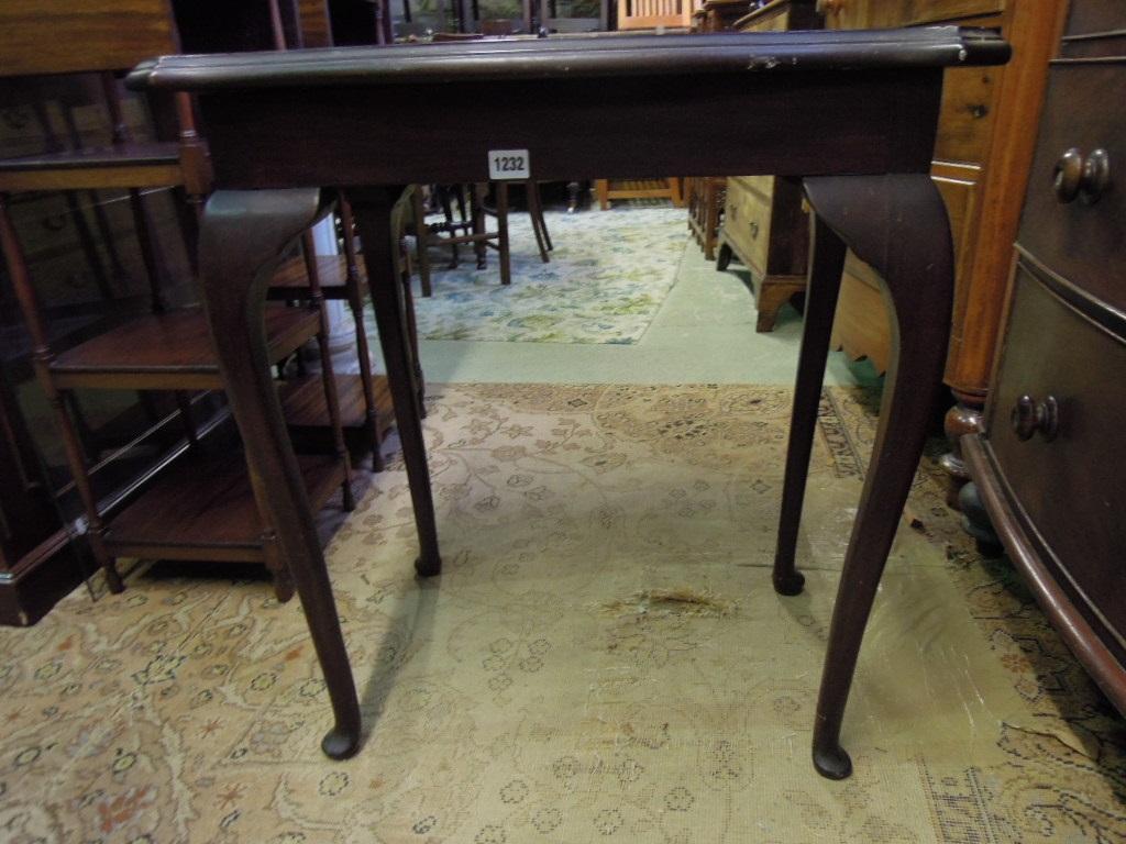 Appraisal: An Edwardian mahogany occasional table of rectangular form with shaped