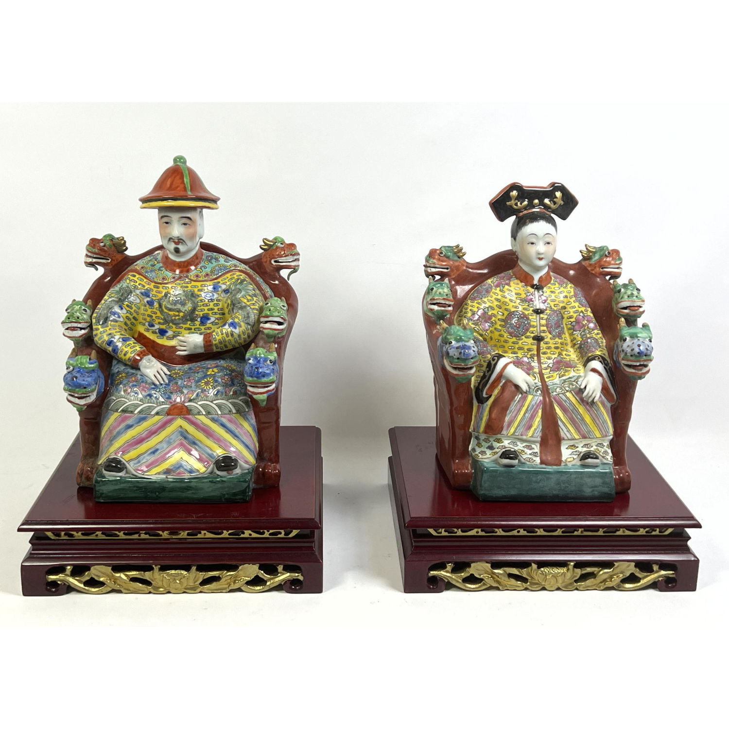 Appraisal: Pair Chinese Porcelain Royalty Figures with wood Stands Porcelain only