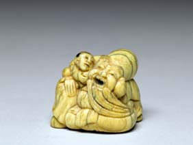 Appraisal: ANTIQUE IVORY NETSUKE Antique carved ivory netsuke of a seated