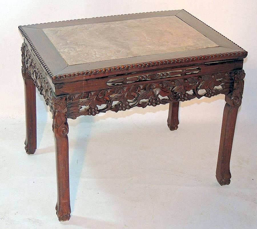 Appraisal: Chinese Hardwood Occasional Table Marble-inset top over a foliate-pierced frieze