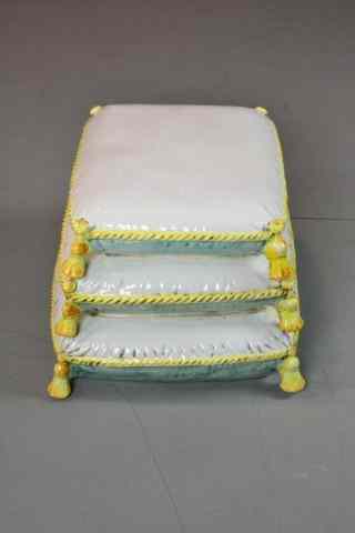 Appraisal: A Victorian Style Porcelain Foot StoolThree graduated porcelain pillows in