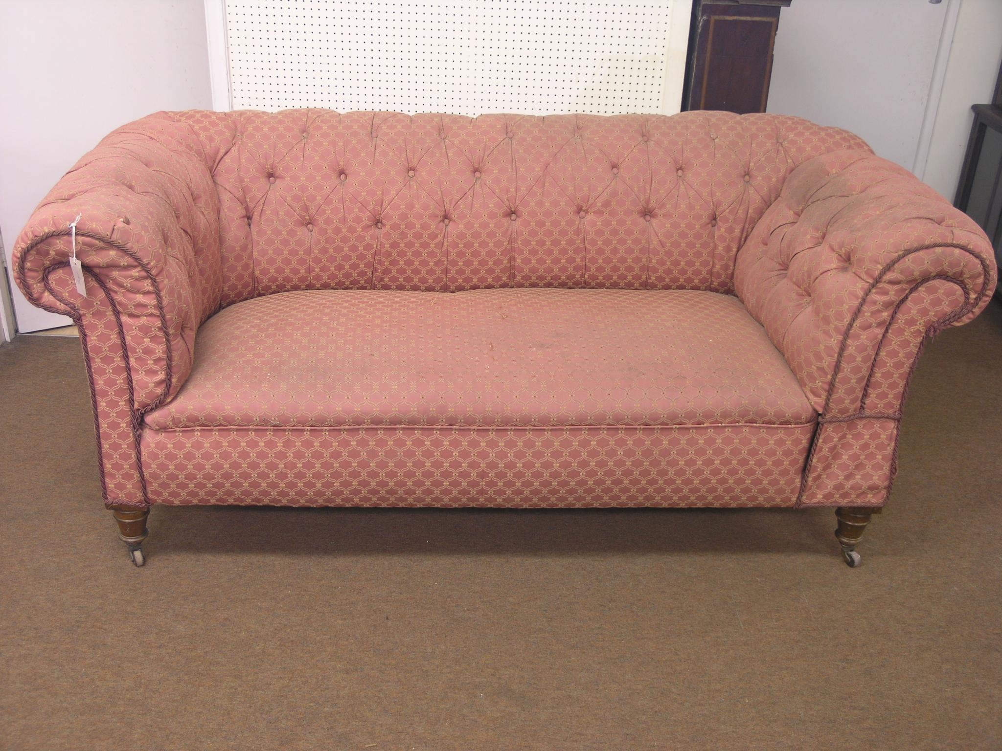 Appraisal: A Victorian Chesterfield drop-end settee walnut frame on front turned