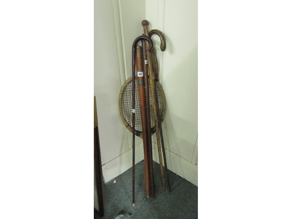 Appraisal: Lot of assorted walking sticks and a vintage tennis racket