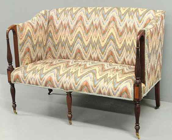 Appraisal: Sheraton style inlaid mahogany love seat with floral upholstery reeded