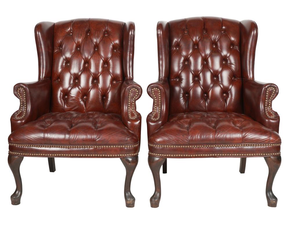 Appraisal: PAIR GEORGIAN-STYLE WING CHAIRSmanufacturer unknown covered with burgundy leather or