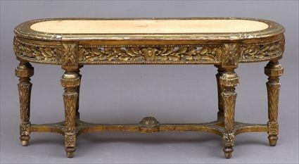 Appraisal: LOUIS XVI-STYLE CARVED GILTWOOD LOW TABLE The oval top above