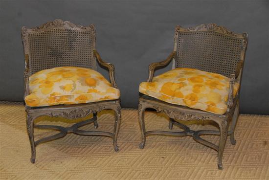 Appraisal: PAIR LOUIS XV-STYLE CARVED FAUTEUIL With cane back seat and