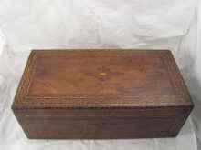 Appraisal: A large mahogany writing slope with parquetry inlay secret drawer