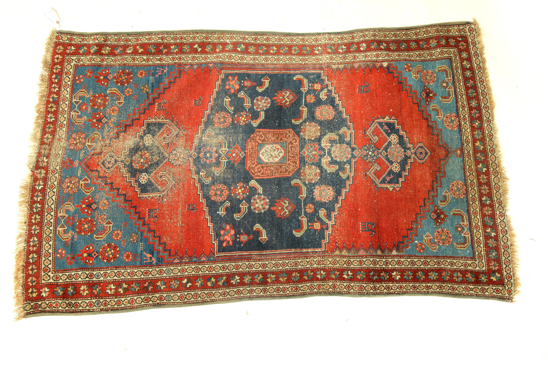 Appraisal: ORIENTAL RUG Mosul Red ground blue spandrels Worn ' ''